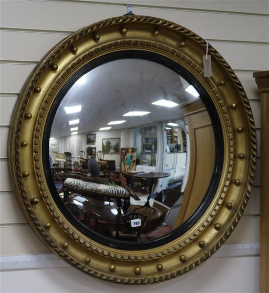 A large Regency style gilt convex mirror w.85cm
